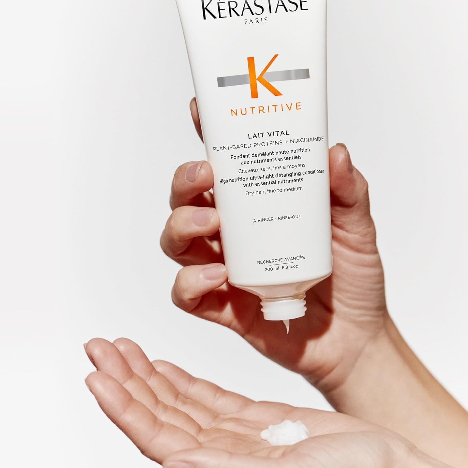 KÉRASTASE in bathroom setting styled with plants to convey daily luxury routine