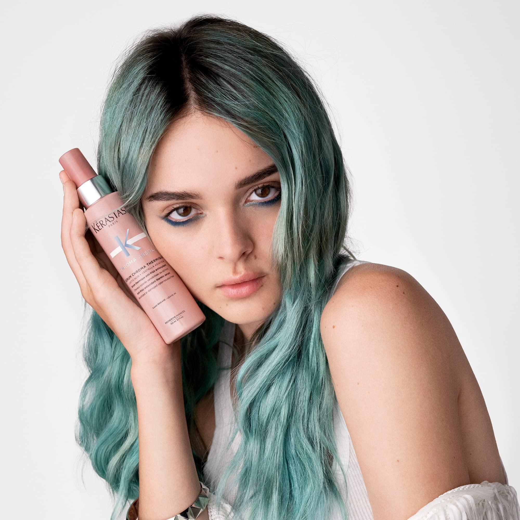 KÉRASTASE on a bathroom shelf lifestyle image conveying salon-finish results