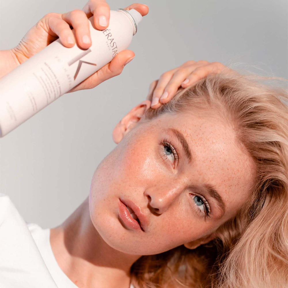 KÉRASTASE ingredient panel with Vitamin E focus, indicating conditioning benefits