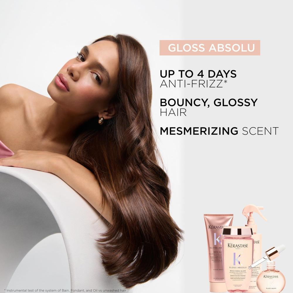 KÉRASTASE 16.9 fl oz refill next to standard bottle to show scale and value