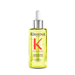 KÉRASTASE front bottle shot showing sleek packaging and product benefit