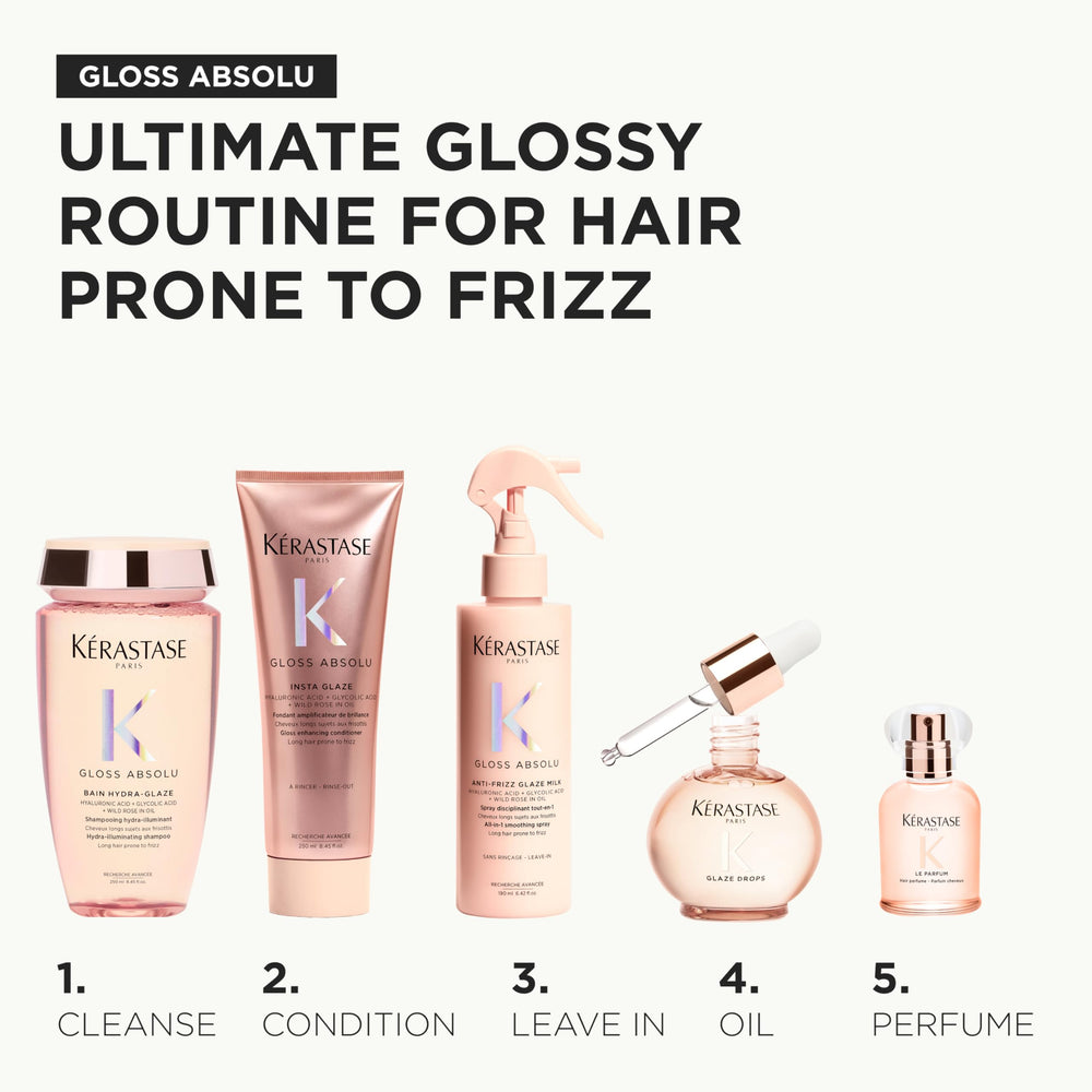 KÉRASTASE woman spraying hair outdoors showing mood-lifting fragrance ritual