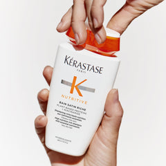 KÉRASTASE shampoo in-shower application showing lather and improved detangling