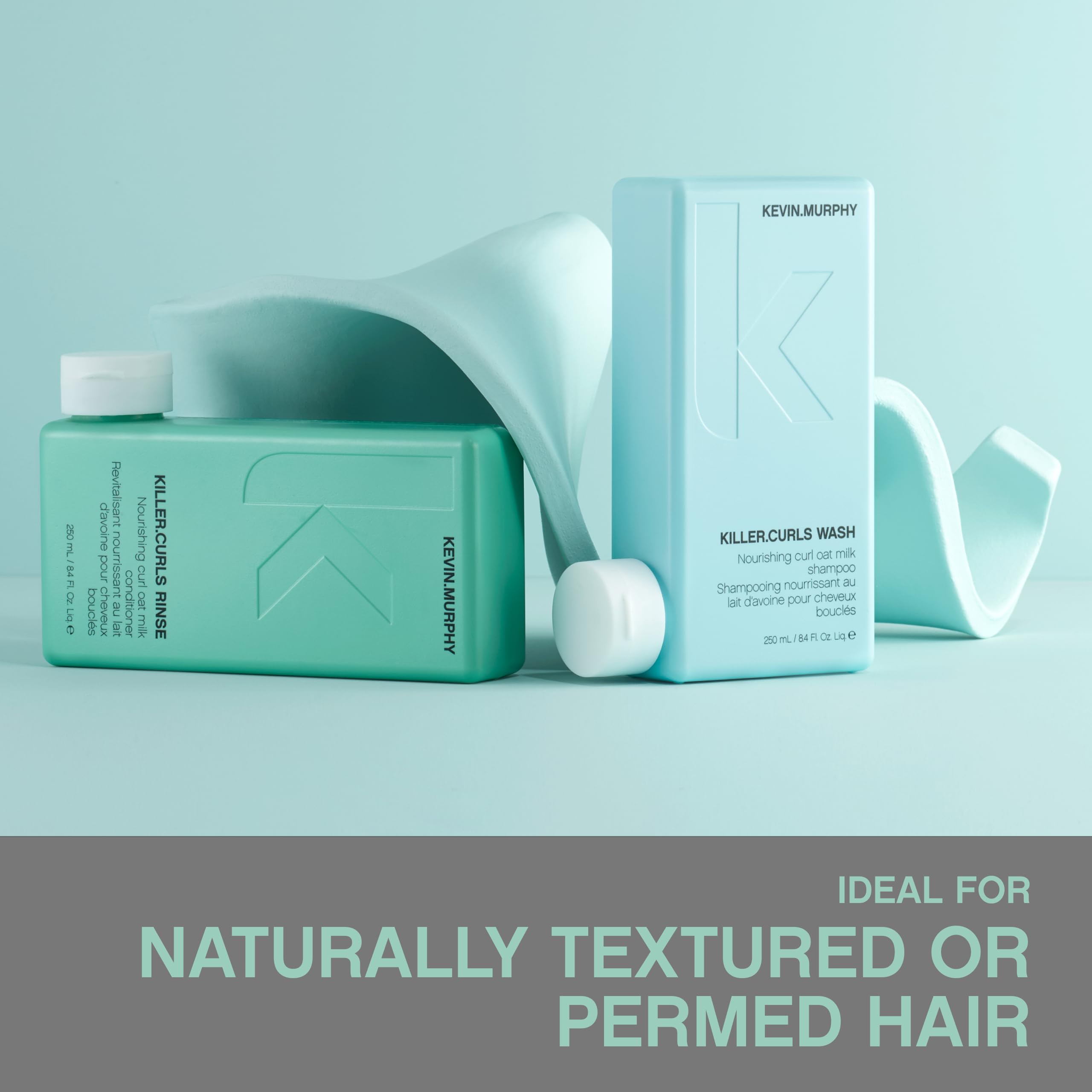 KEVIN.MURPHY bottle held in hand illustrating compact travel-friendly size