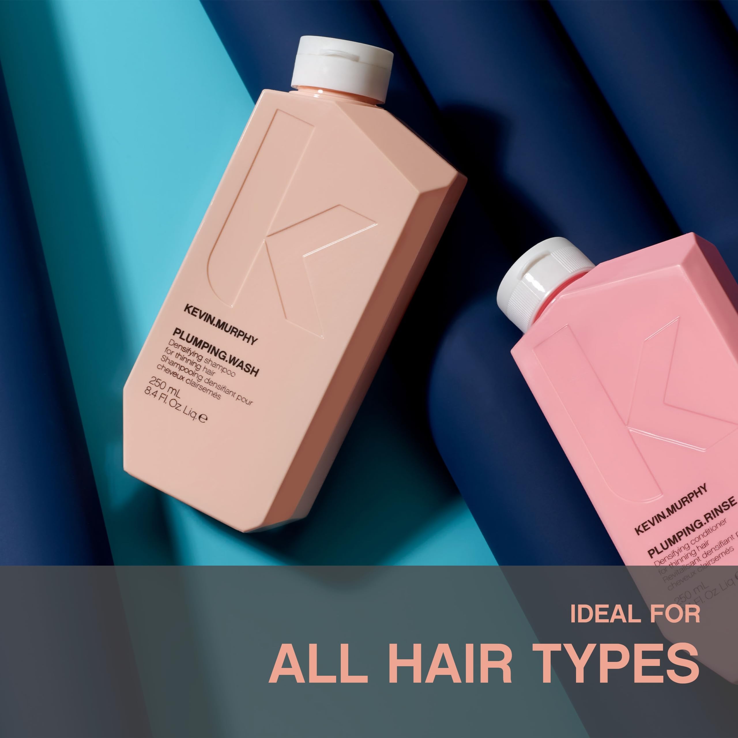 KEVIN.MURPHY plumping.wash held in hand showing 8.4 fl oz size and travel convenience