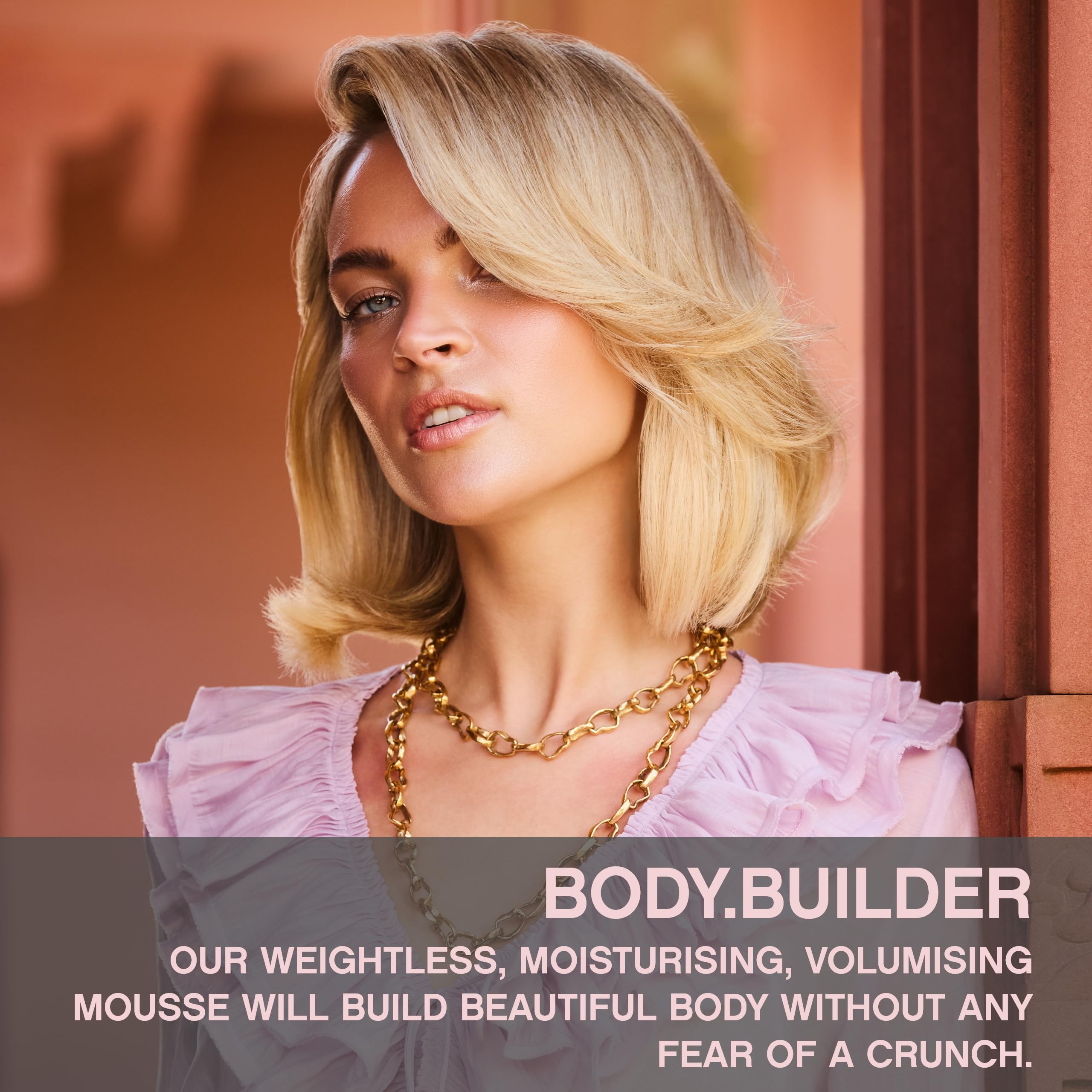 KEVIN.MURPHY mousse foam texture dispensed on hand showing airy, weightless formula for easy even application
