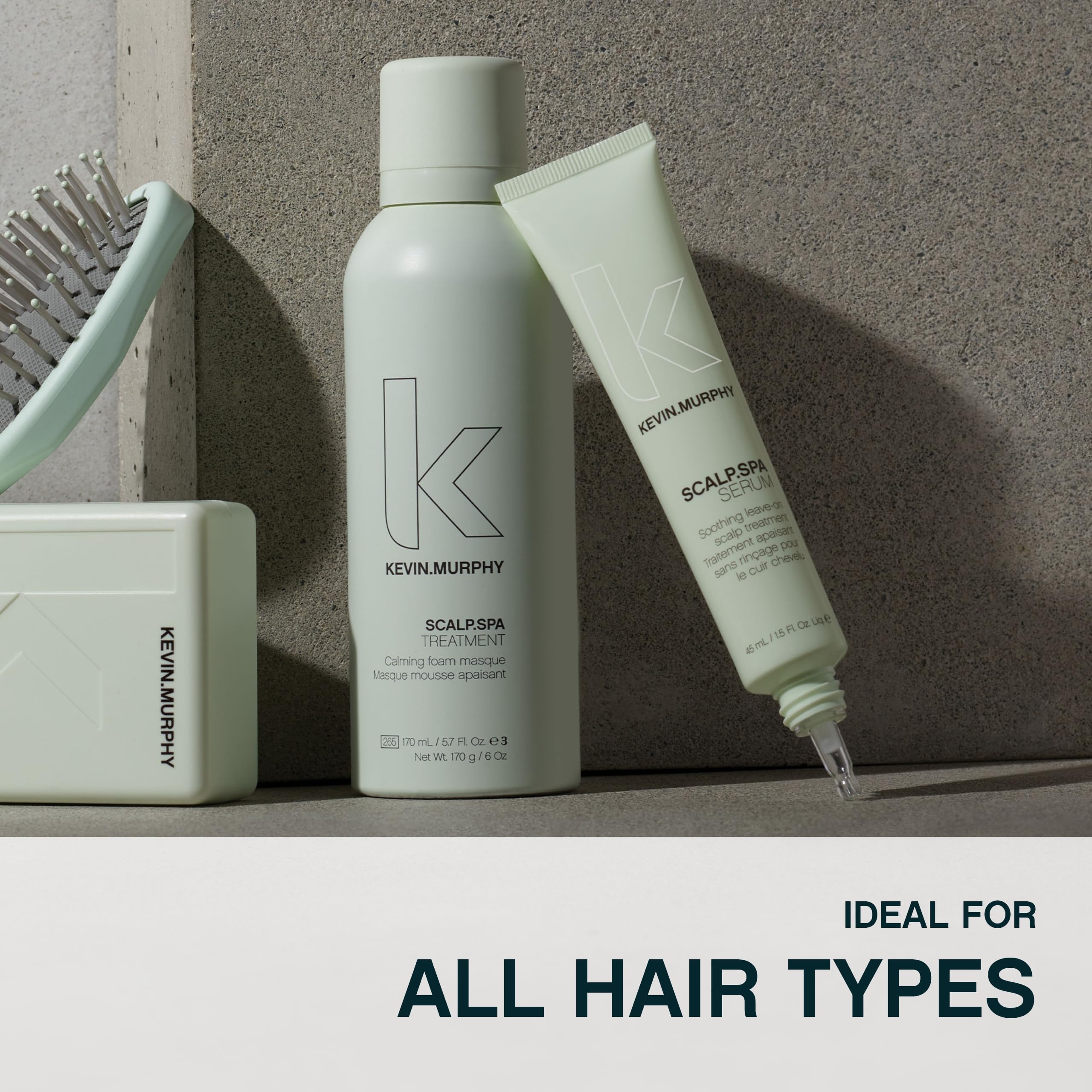 KEVIN.MURPHY 100ml bottle beside hand to show compact travel size