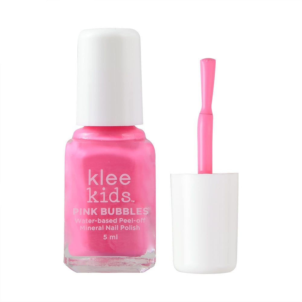 Klee Naturals kit beside a hand for scale to show compact kid-friendly sizes