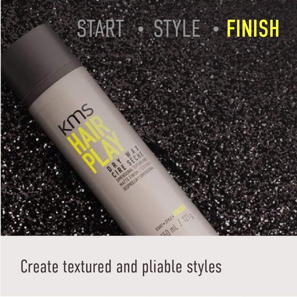 KMS hairplay dry wax tin in hand displaying compact 4.3 oz size for travel
