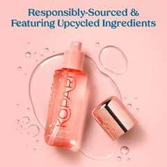 Kopari being applied to hair ends to leave long-lasting tropical scent without weighing hair down
