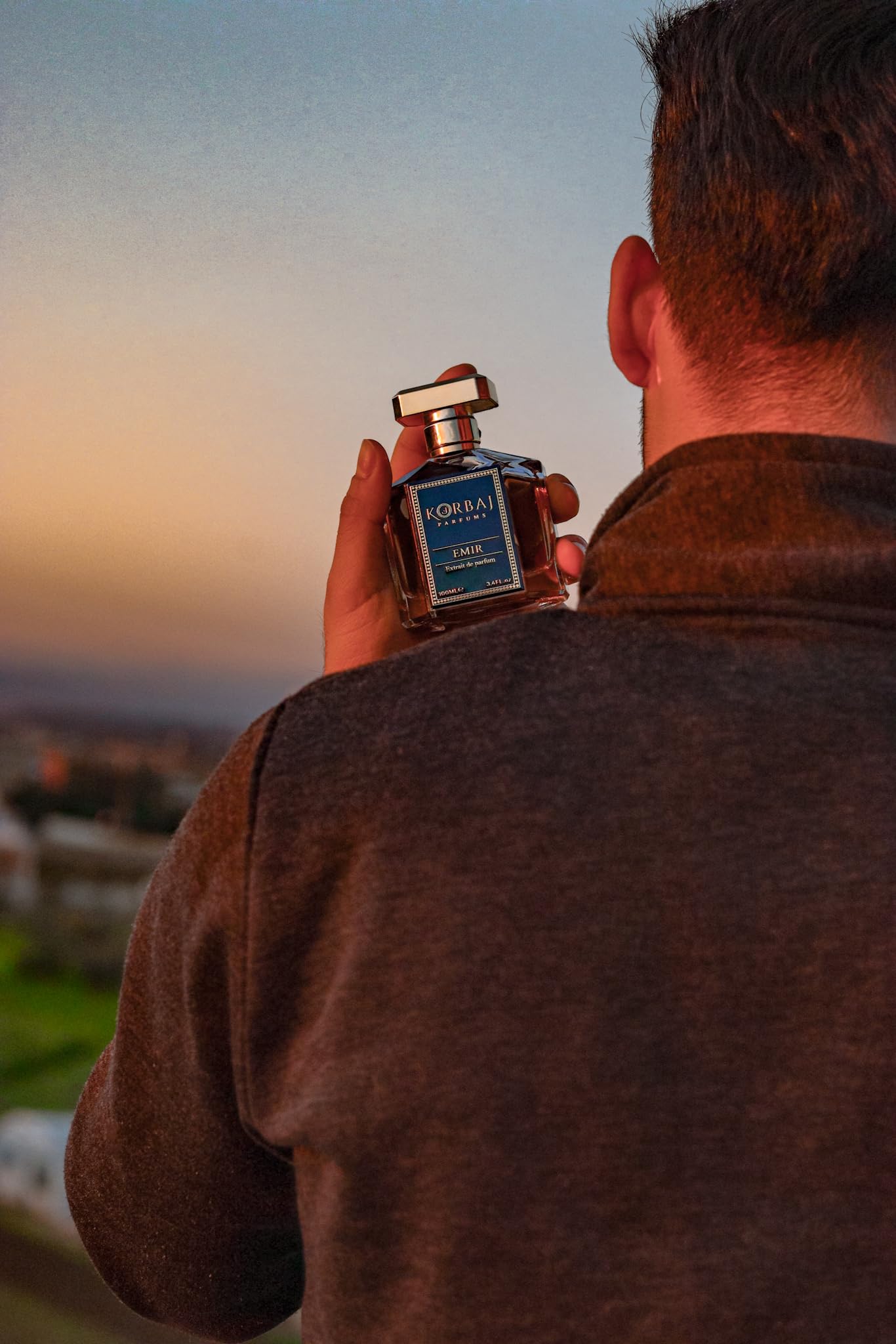 KORBAJ PARFUMS Emir bottle in hand showing 100ml scale and gifting value