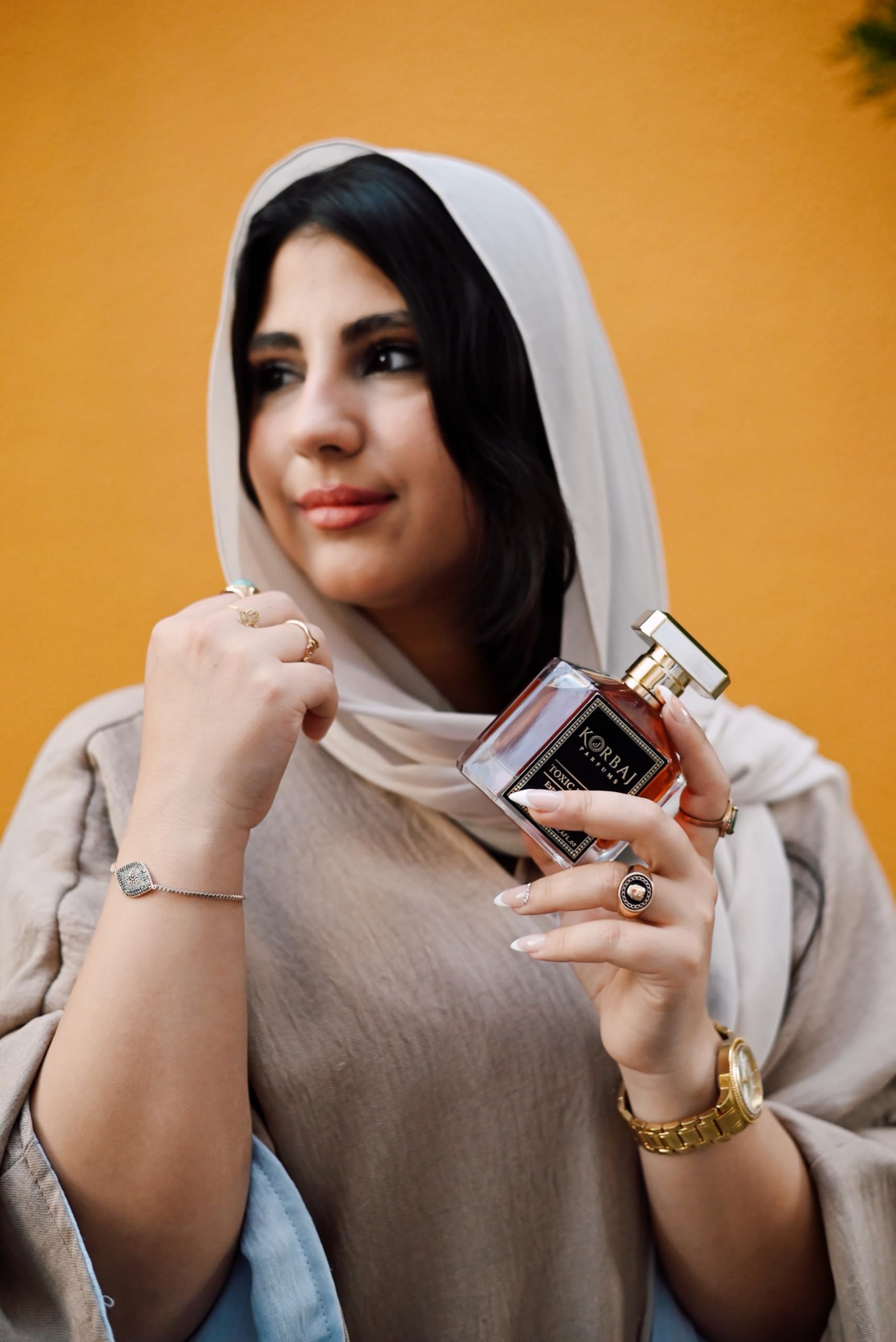 KORBAJ PARFUMS 100ml bottle in hand showing true-size convenience