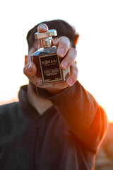 KORBAJ PARFUMS spray nozzle mid-spray demonstrating smooth application benefit