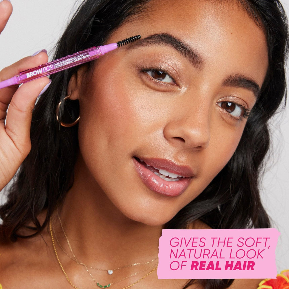 Kosas Brow Pop swatch on arm displays true Brown Black payoff and buildability