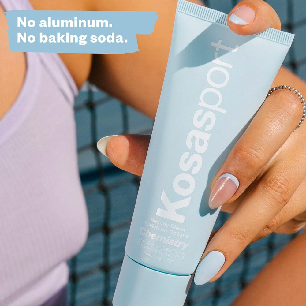 Kosas size comparison in hand to show pocketable roll-on convenience for travel and touch-ups