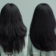 Kristin Ess conditioner creamy texture on fingers showing moisturizing richness