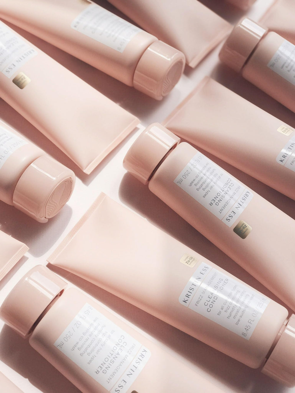 Kristin Ess bottle styled on bathroom shelf suggesting daily routine ease