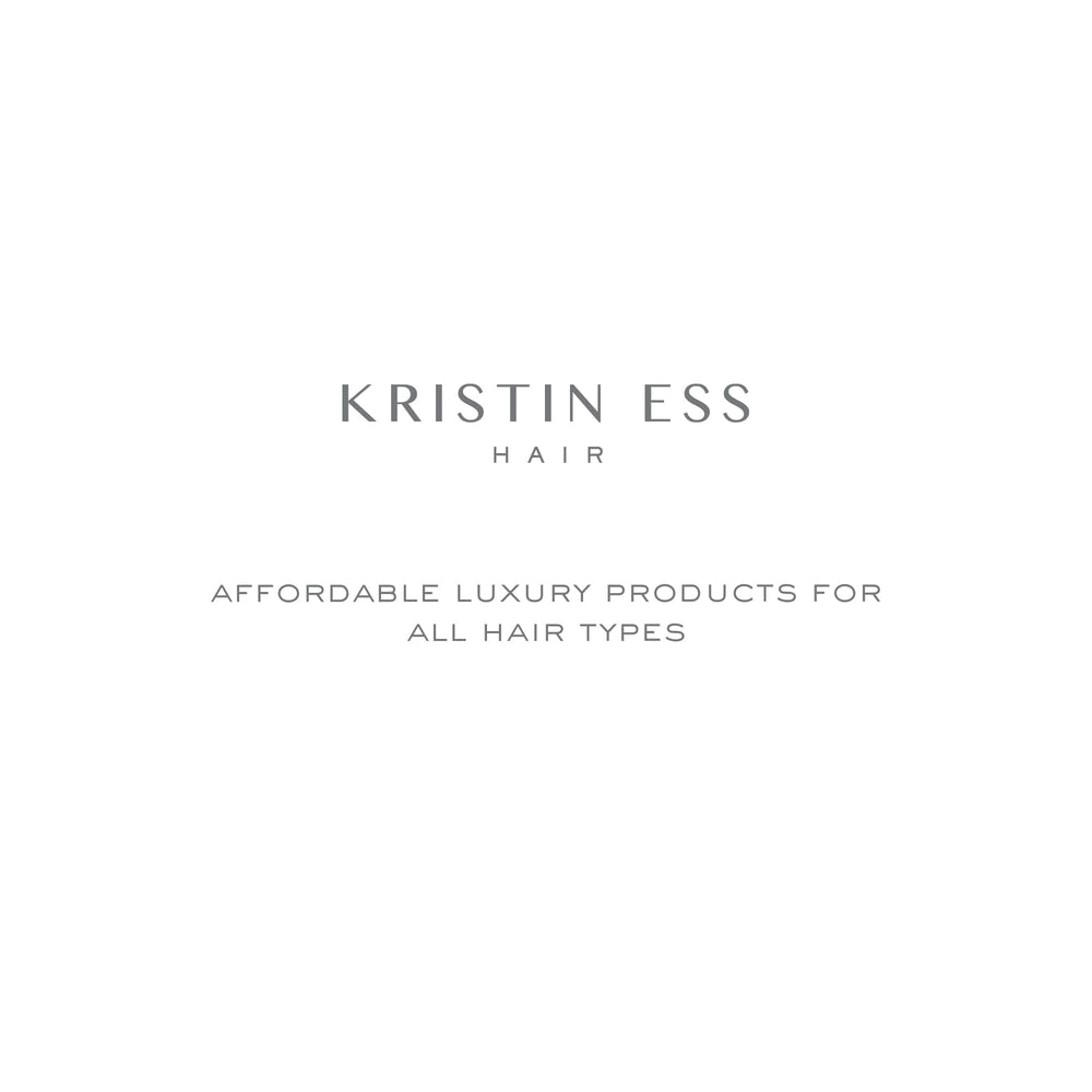Kristin Ess curling iron placed next to hand showing length and 9-foot swivel cord