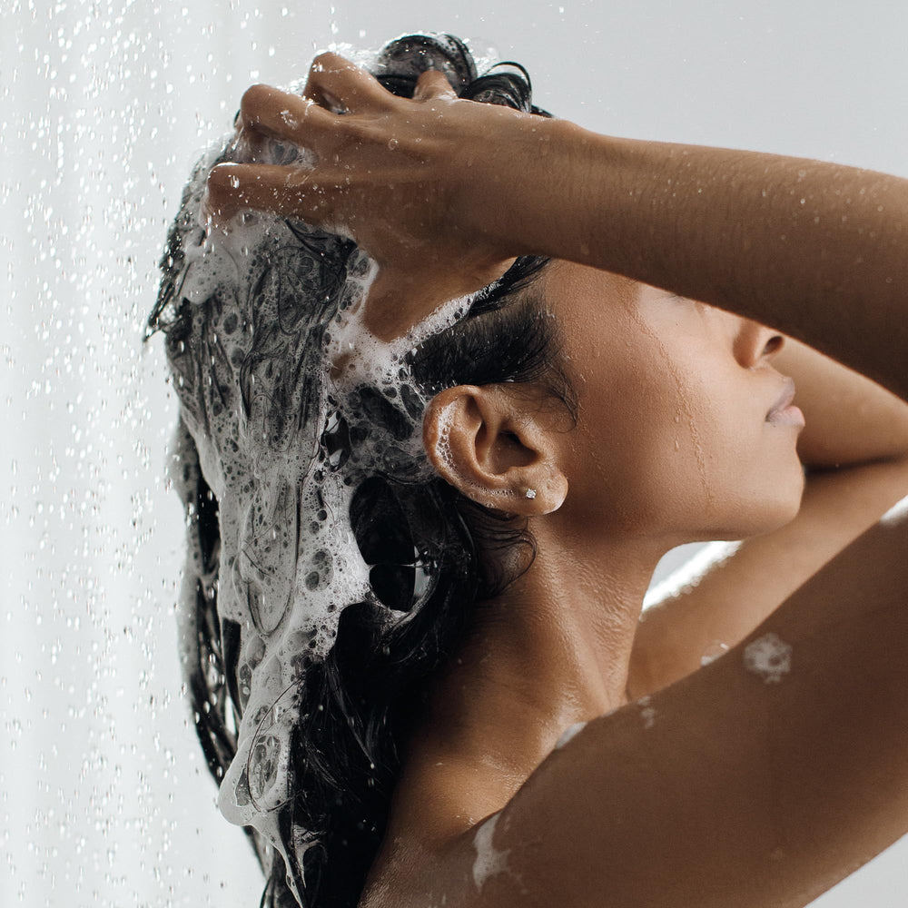 Kristin Ess shampoo lather action removing buildup and oils