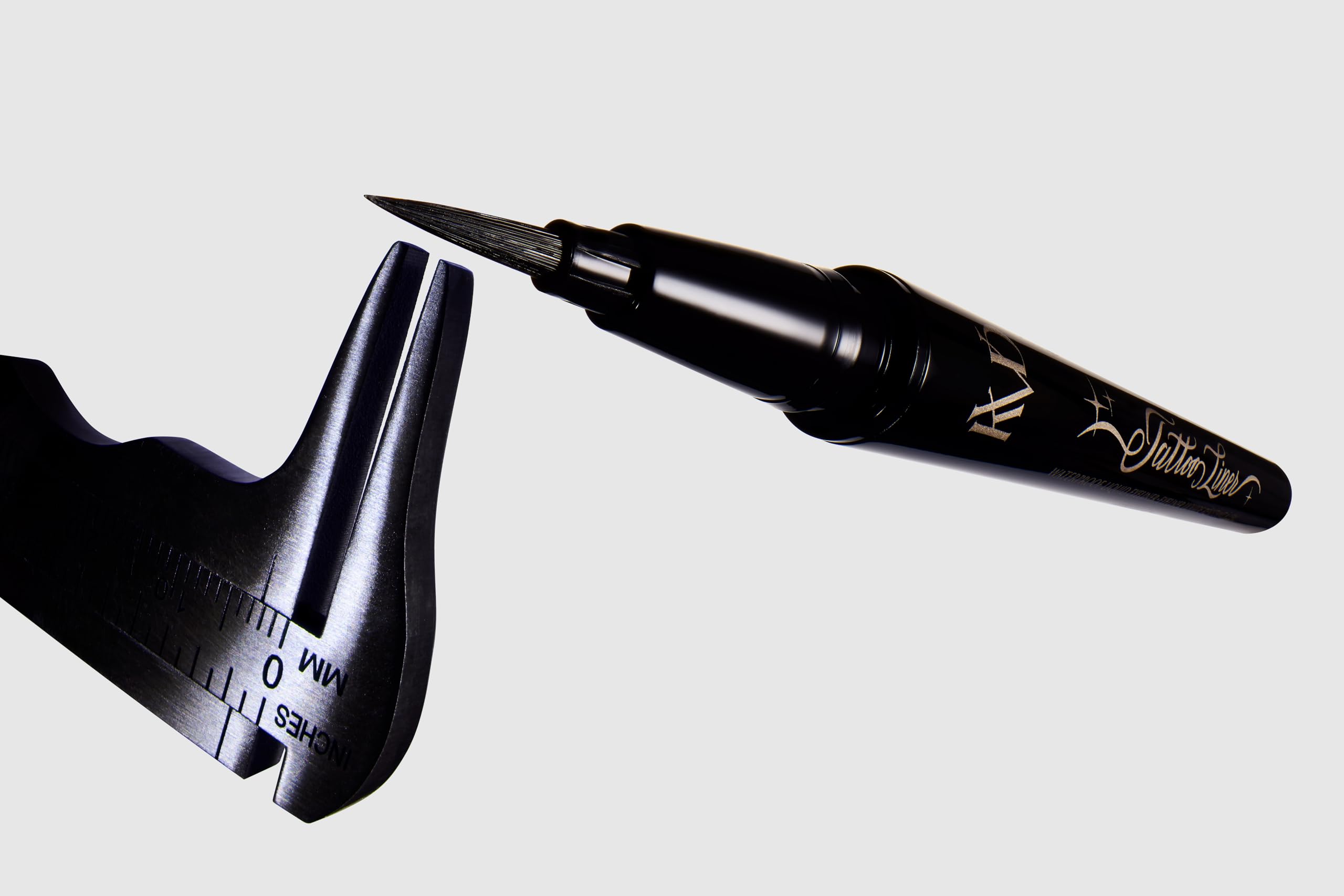 KVD liner beside a pen for scale highlights compact size and travel-friendly benefit