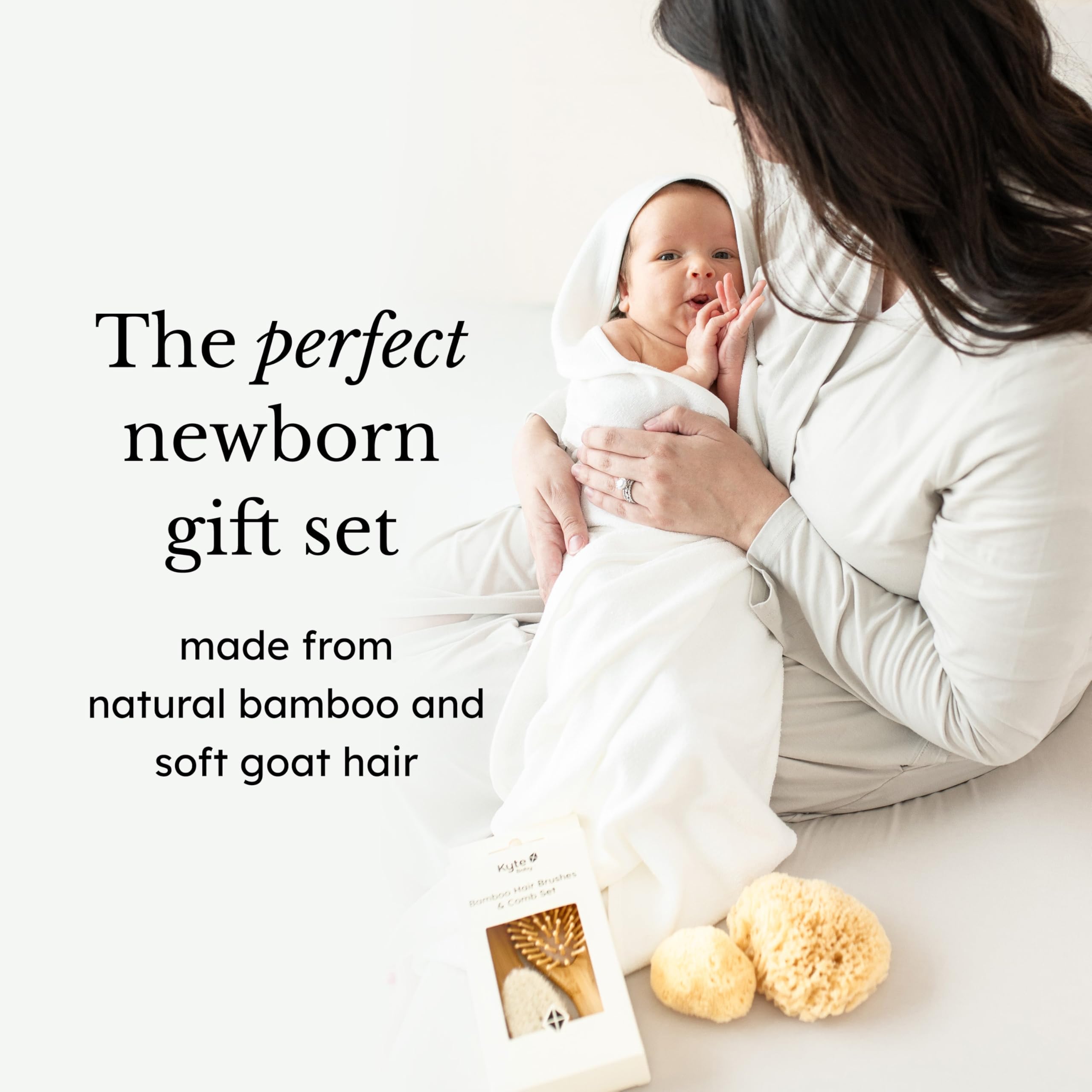 Kyte BABY set in adult hand for size comparison showing portable, ergonomic grip