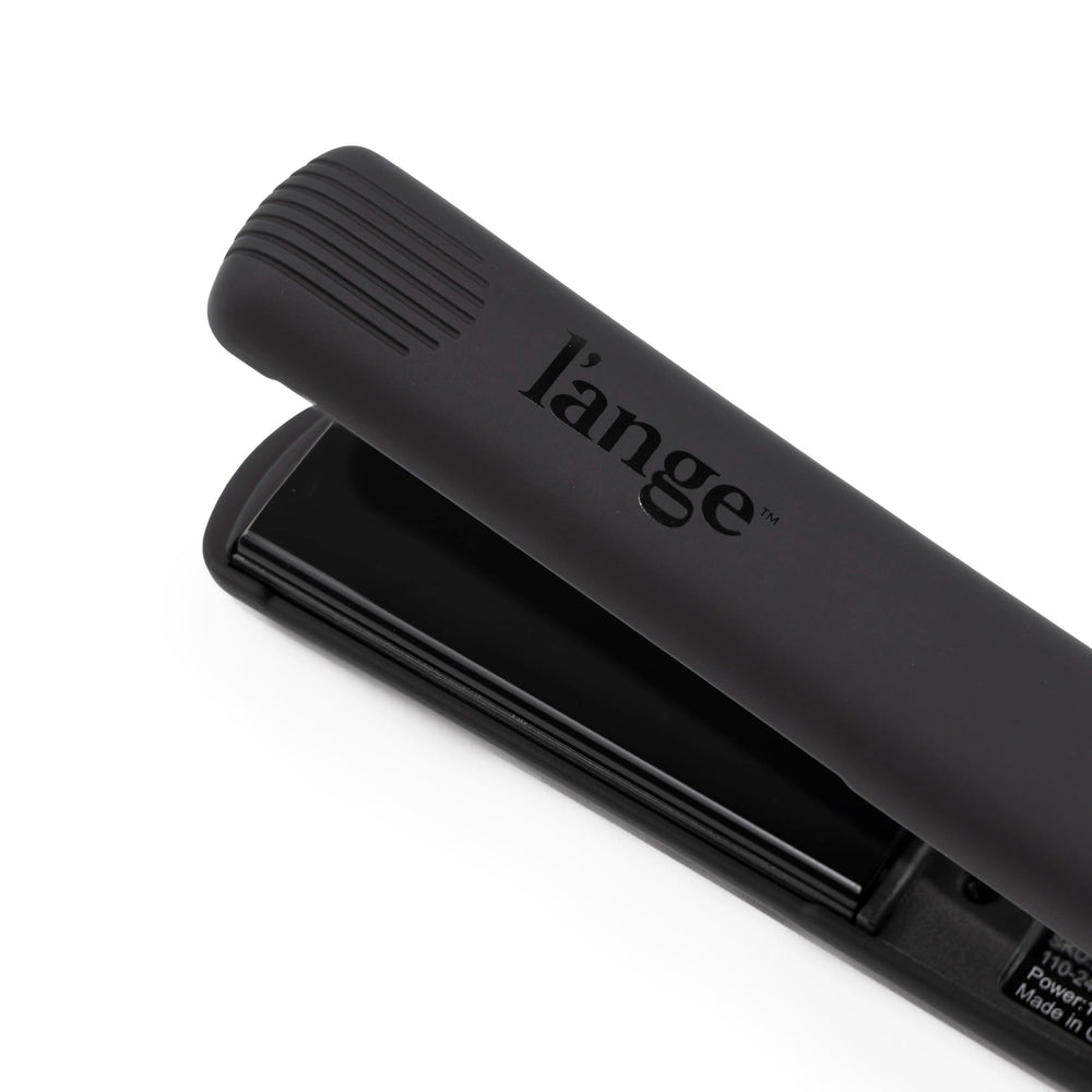 L'ANGE HAIR size comparison in hand showing compact 1-inch plate for precision