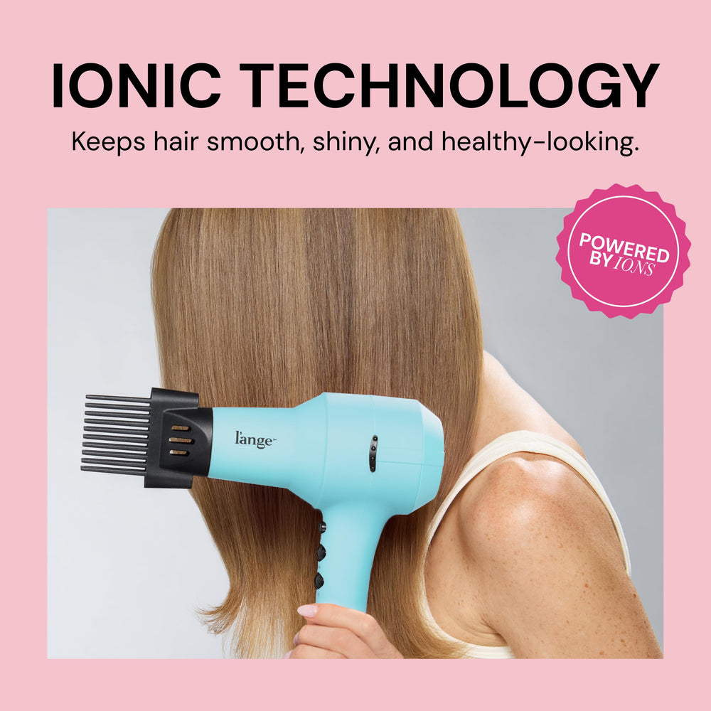 L'ANGE HAIR dryer next to common items indicating compact size and portability