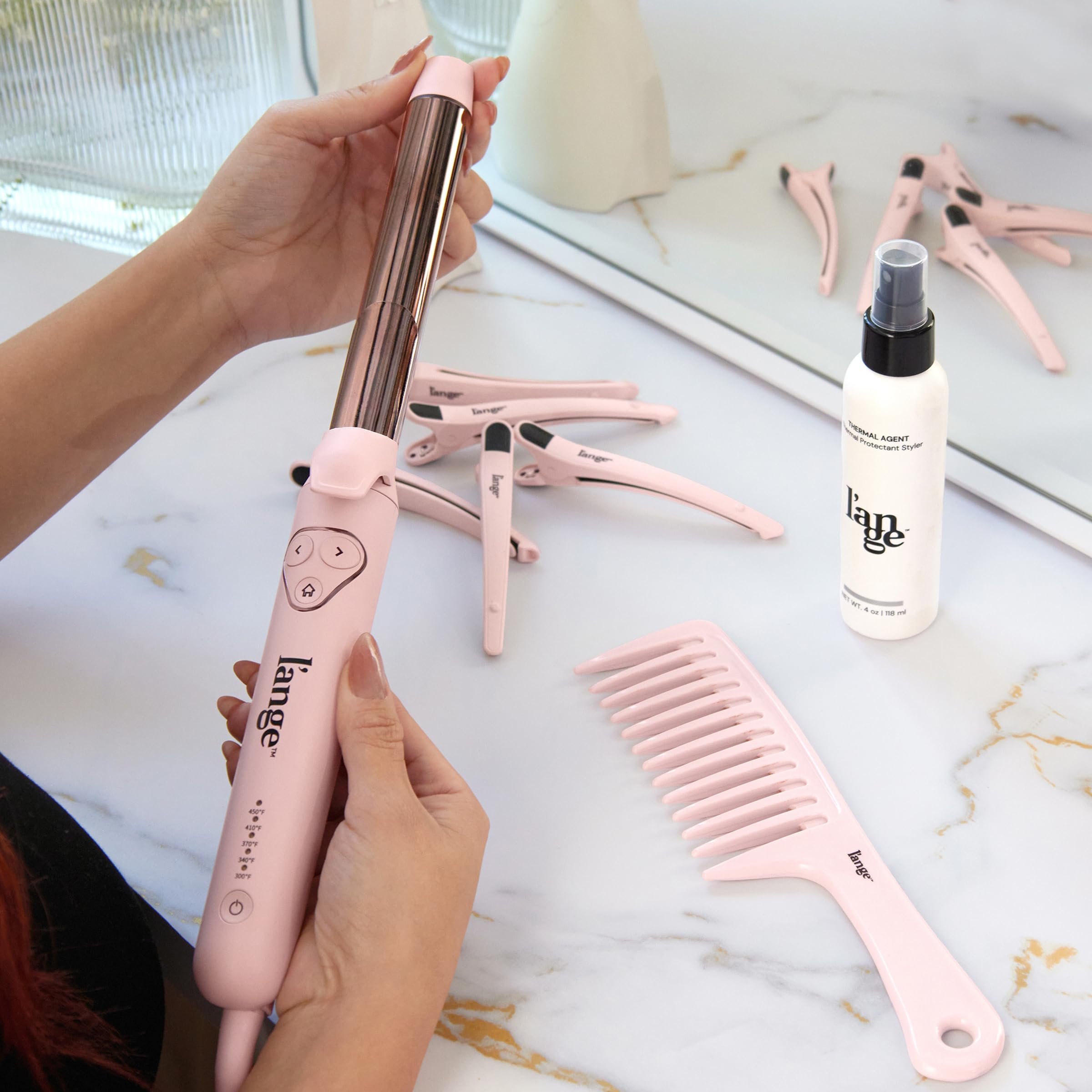 L'ANGE HAIR travel-ready packaging highlighting dual-voltage portability