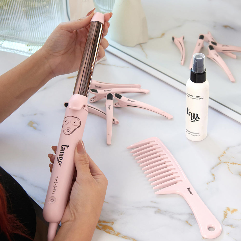 L'ANGE HAIR travel-ready packaging highlighting dual-voltage portability