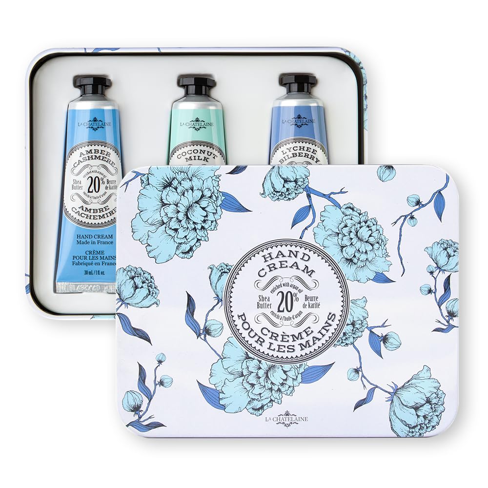 La Chatelaine tins beside a smartphone to show compact travel-friendly size and portability