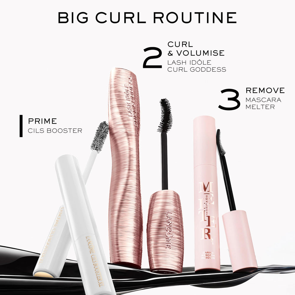 Lancôme travel-size mascara in hand illustrating compact scale and convenience