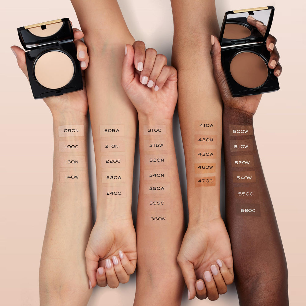 Lancôme open compact revealing pan, mirror, and built-in sponge for convenience