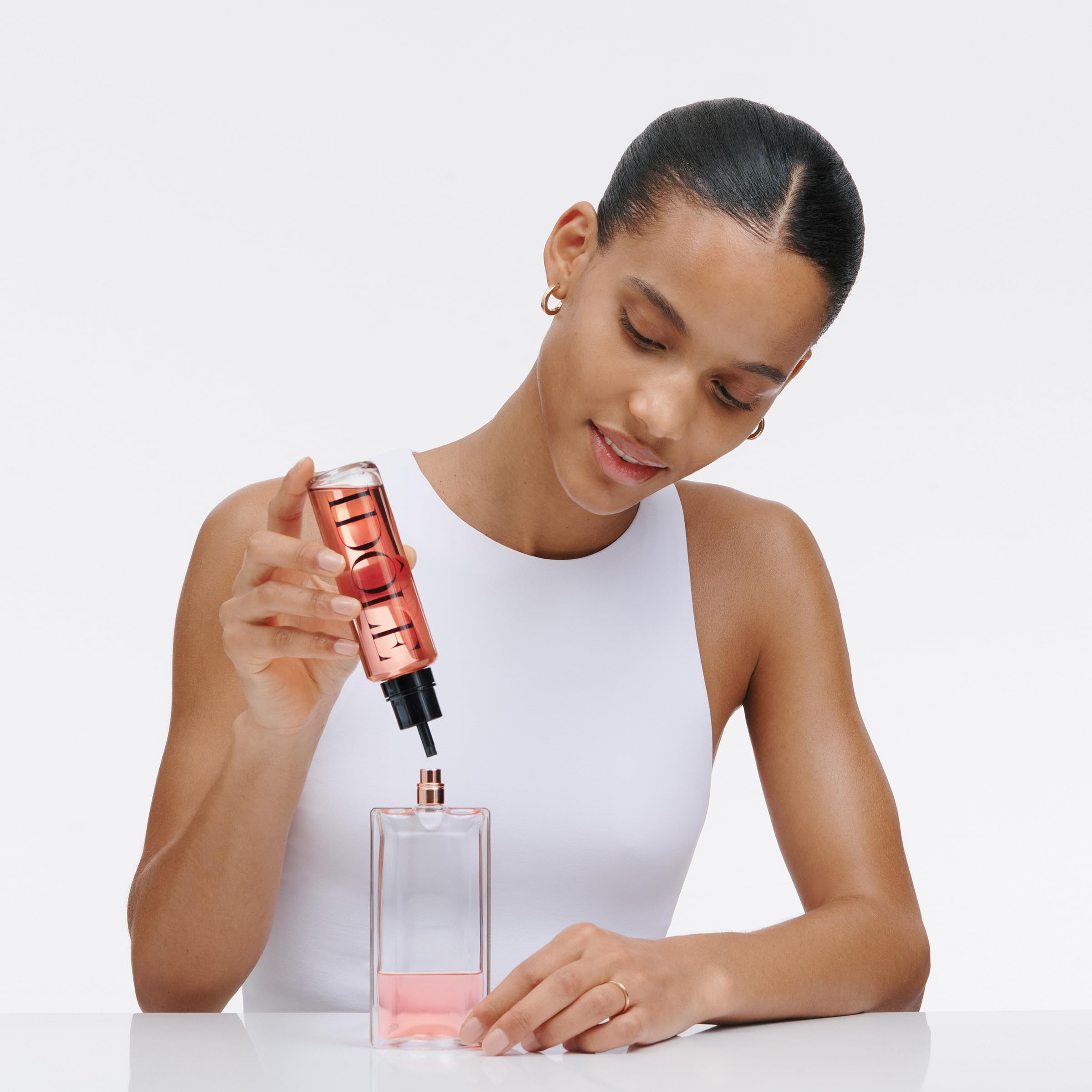 Lancôme Idôle glass texture closeup illustrating clarity and luxury presentation