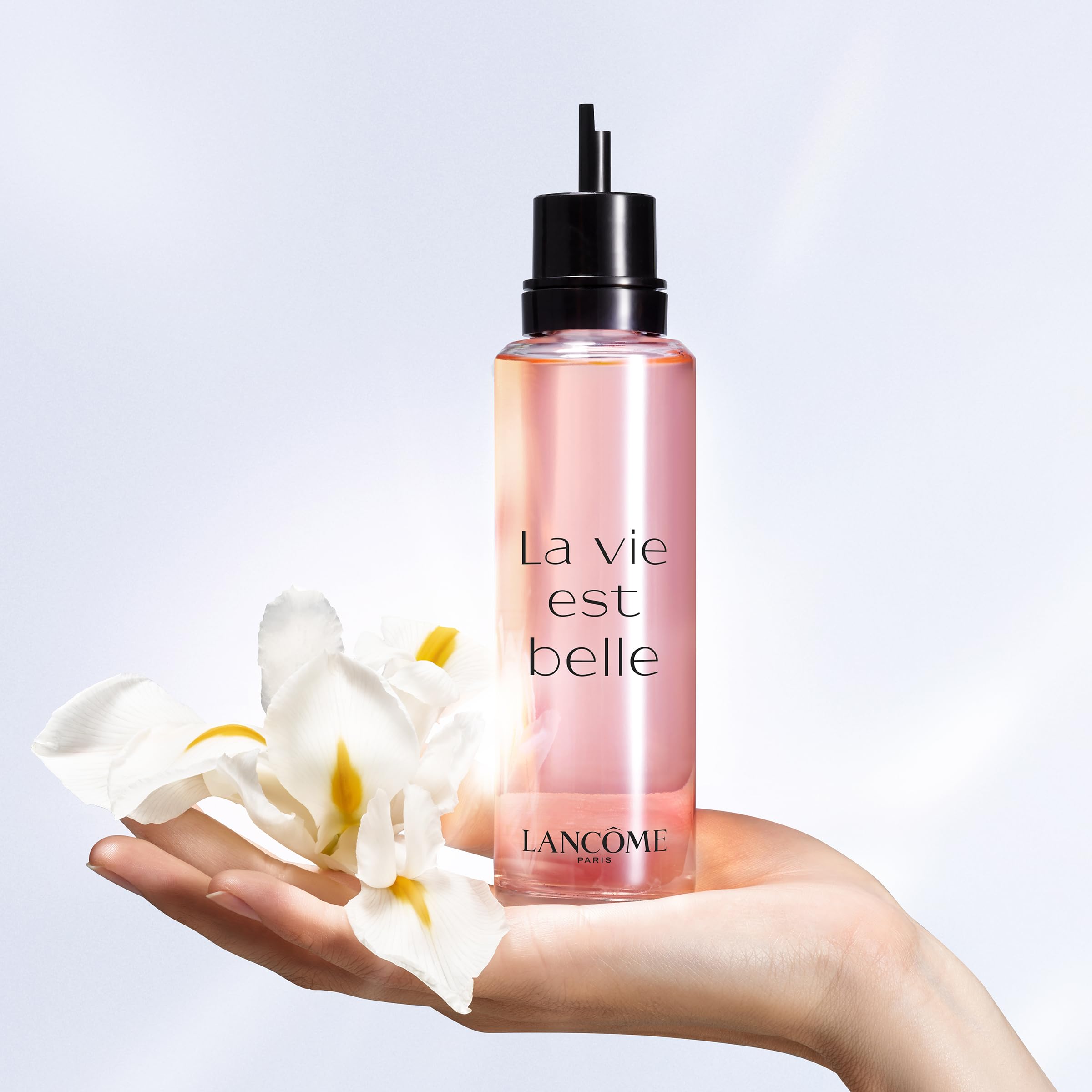 Lancôme perfume applied to wrist demonstrating pulse-point longevity boost