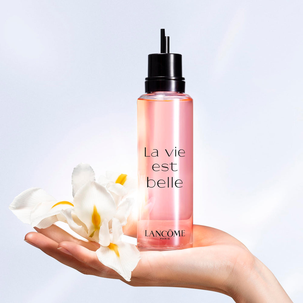 Lancôme perfume applied to wrist demonstrating pulse-point longevity boost