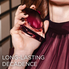 Lancôme close-up of the bottle's dark cherry gradient and shimmering wings highlighting luxury