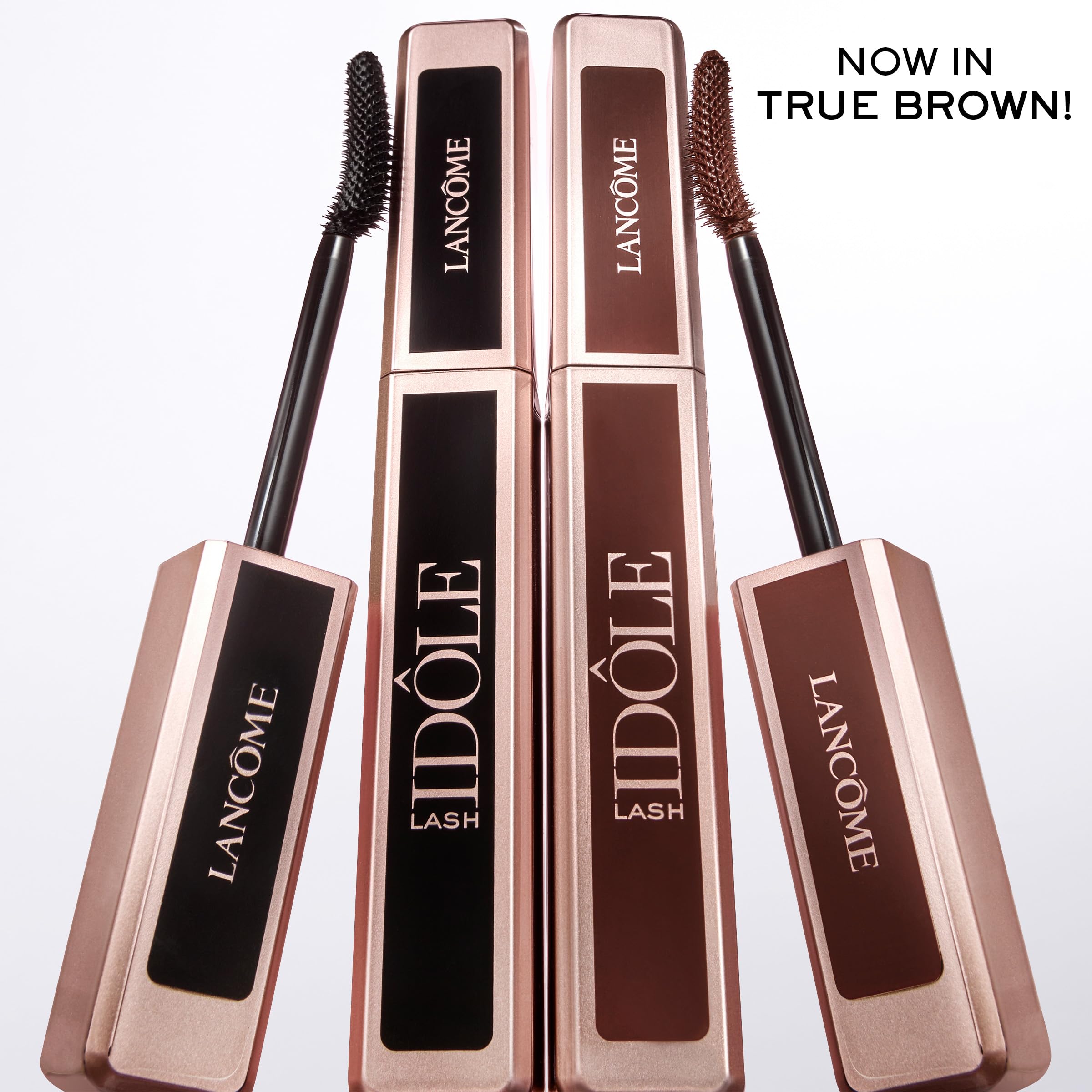 Lancôme Lash Idôle size comparison next to coin for travel convenience