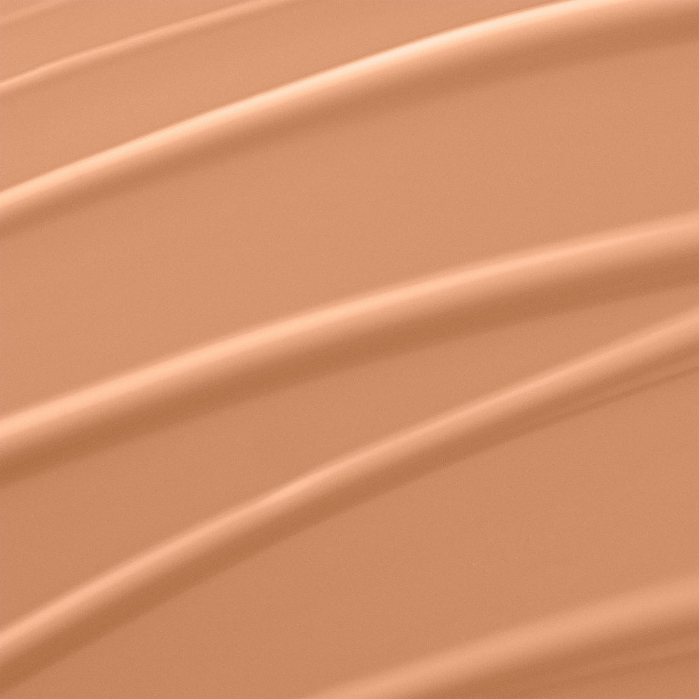 Lancôme Rénergie Lift bottle with cap removed dispensing foundation demonstrating smooth blendability