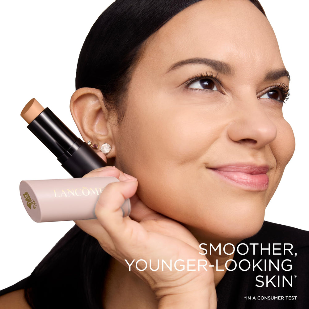 Lancôme stick being applied with fingers offering quick, on-the-go blending benefit