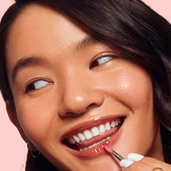 LANEIGE Lip Glowy Balm close-up stick delivering portable moisture and shine