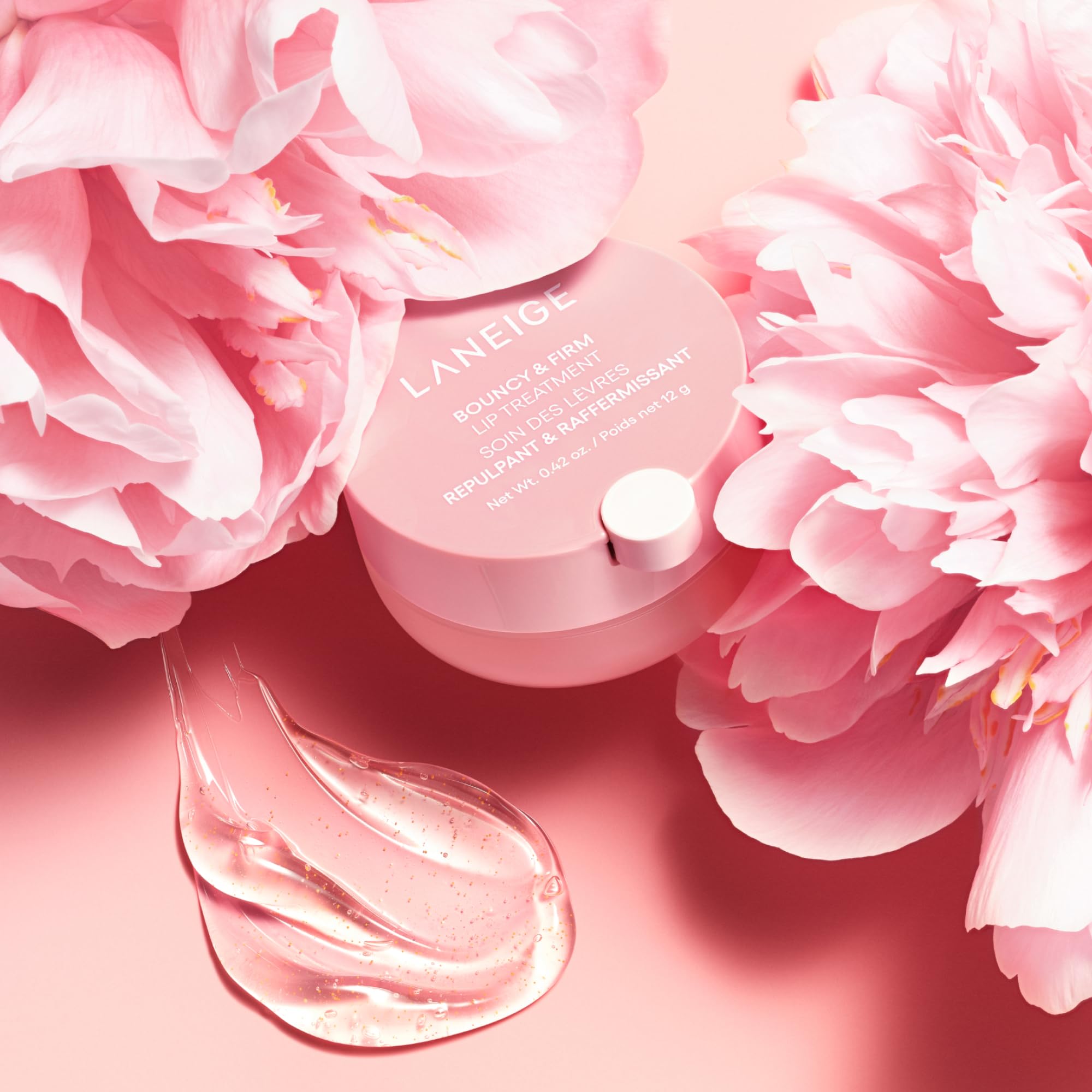 LANEIGE applying treatment to lips demonstrating smooth finish and instant plump benefit