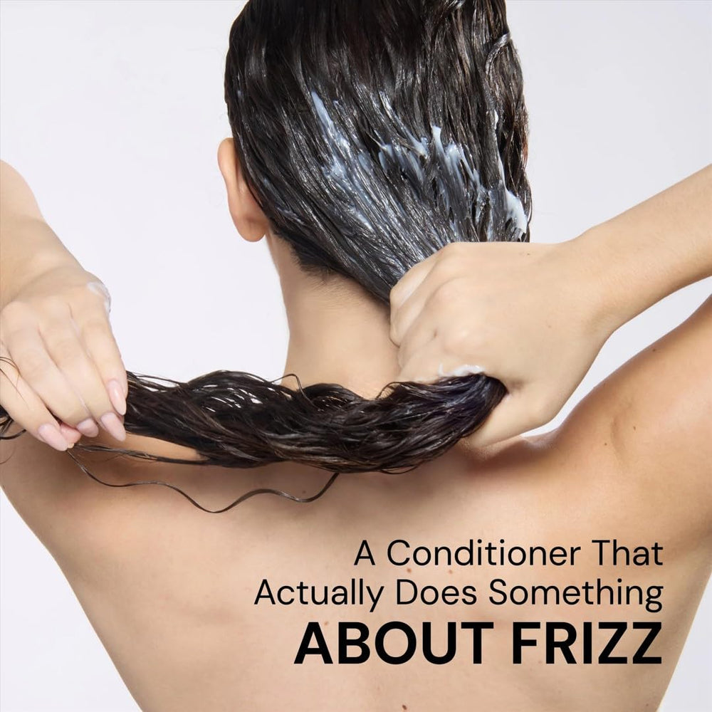 L'ANGE HAIR conditioner on bathroom shelf in styling routine for frizz control