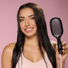 L'ANGE HAIR brush detangling wet hair to distribute conditioner evenly
