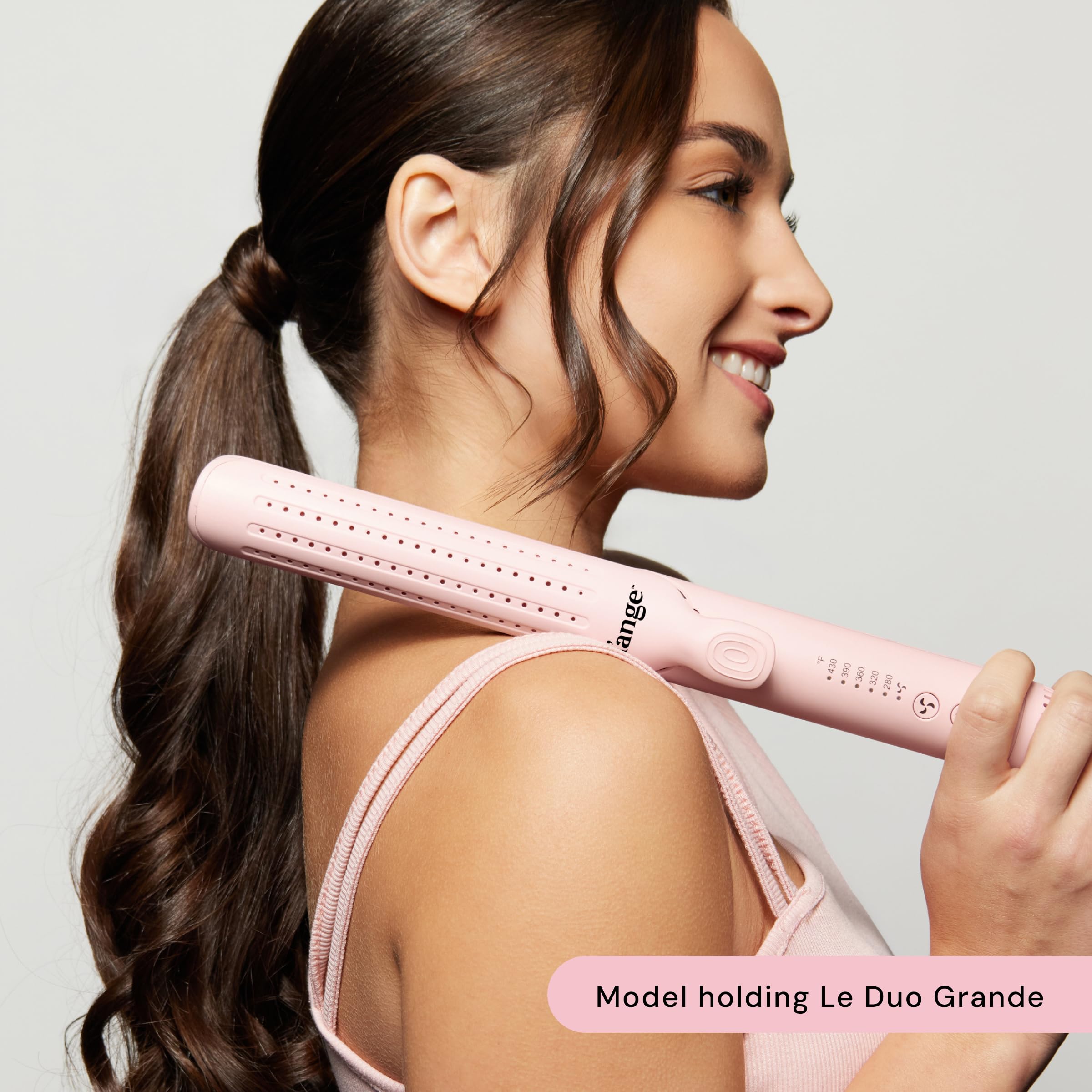 L'ANGE HAIR shown curling long hair to create defined bouncy curls