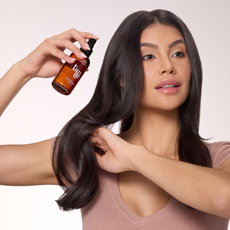 L'ANGE HAIR product in lifestyle setting illustrating travel-friendly hydration and protection benefit