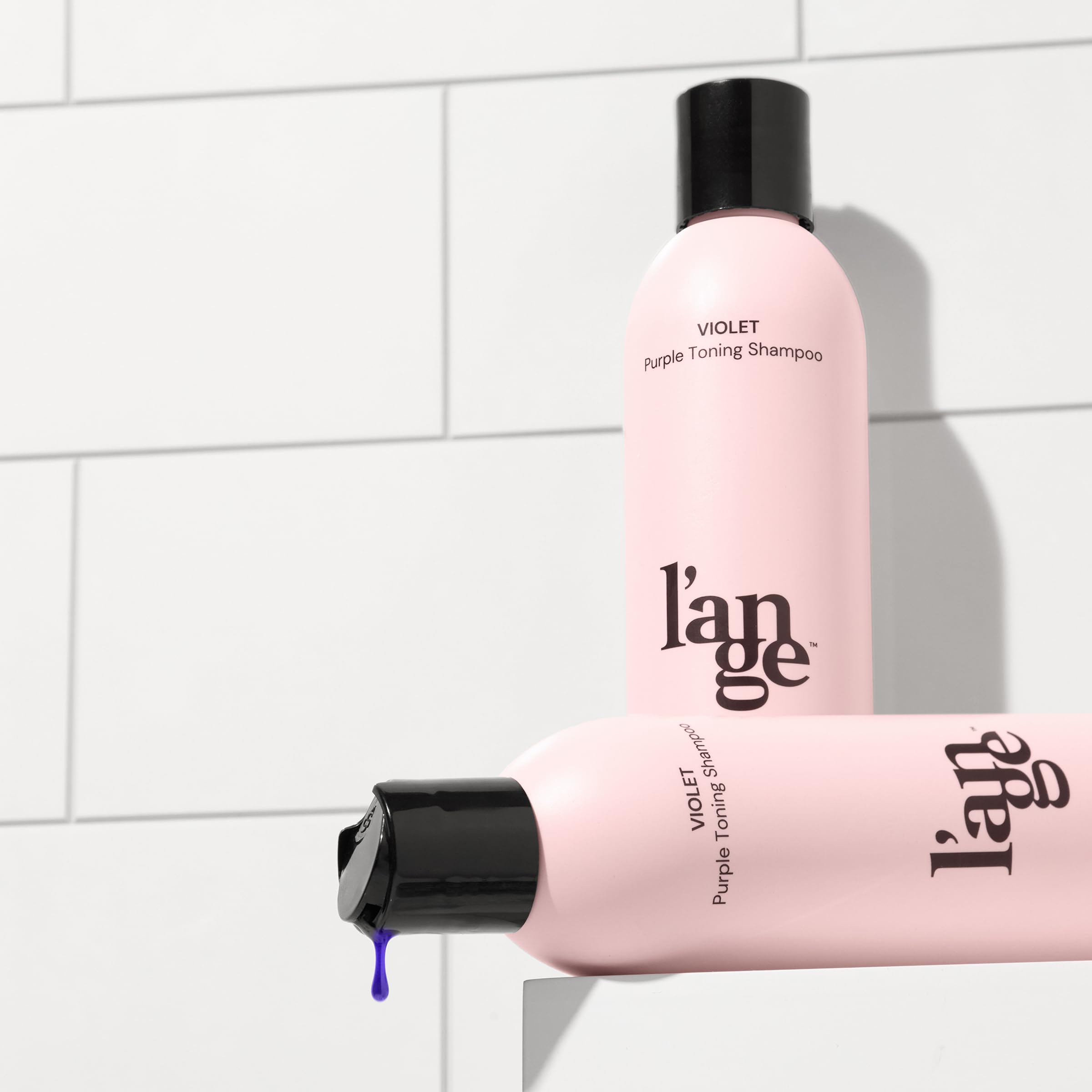 L'ANGE HAIR bottle next to hand showing true product size