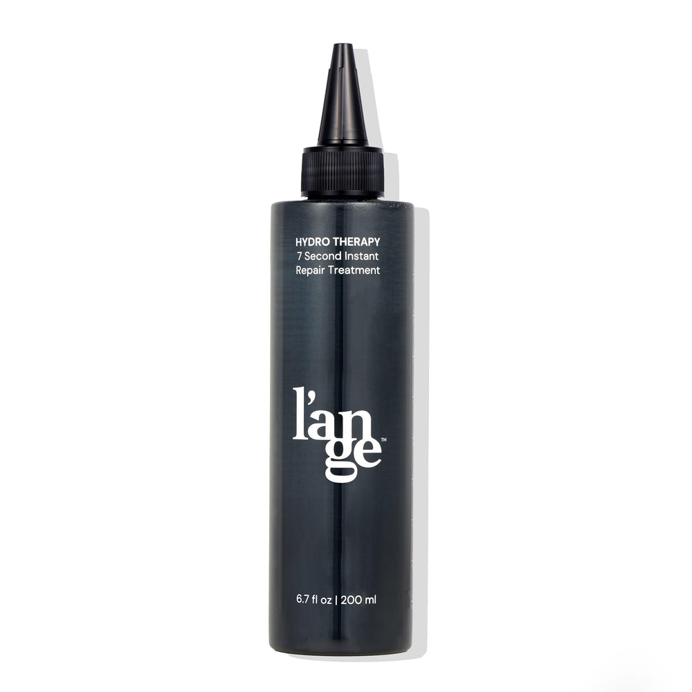 L'ANGE HAIR front bottle showing product branding and easy-grip design for fast use