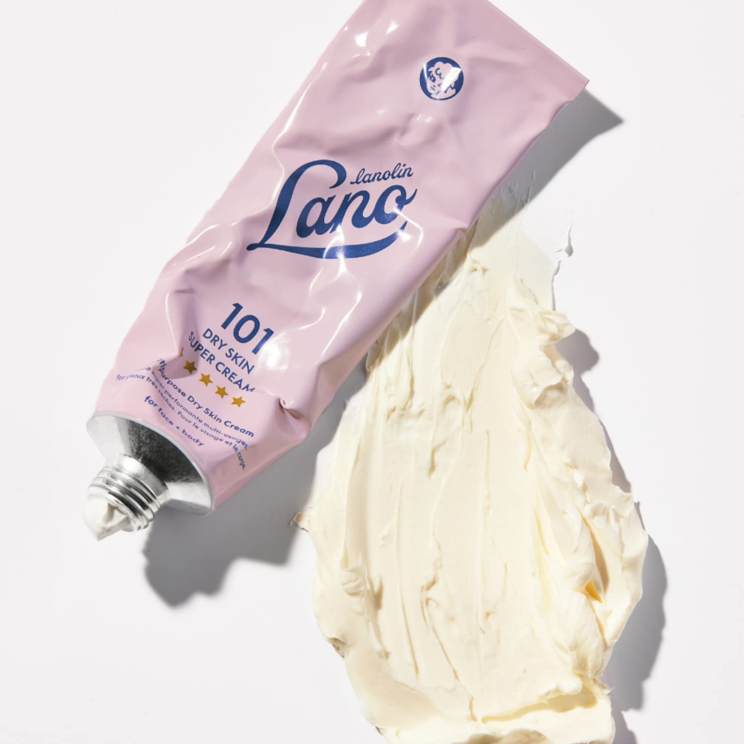 Lanolips beside a coin demonstrating the travel-friendly 2.02 oz size