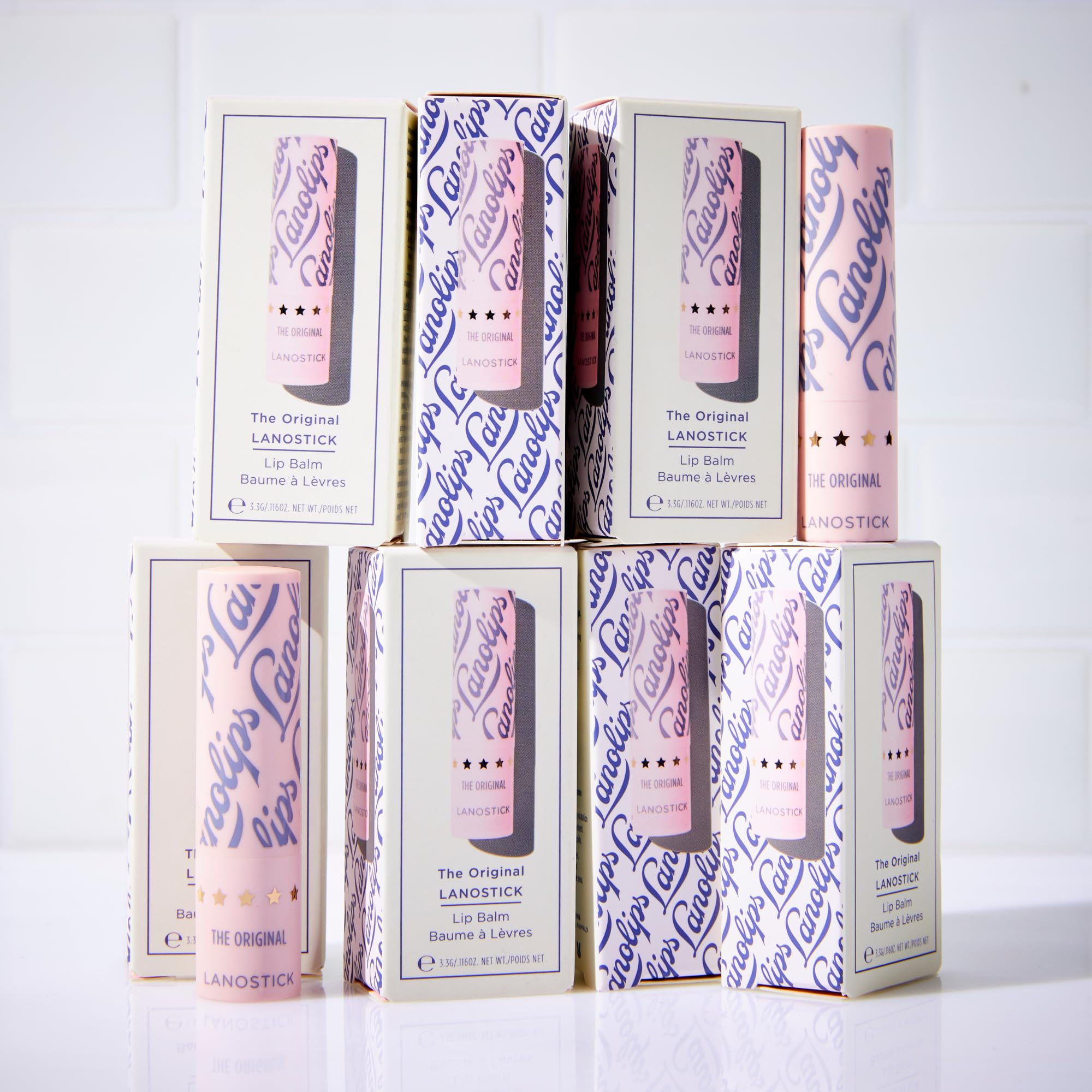 Lanolips Lanostick next to a coin for scale showing small size and convenient portability