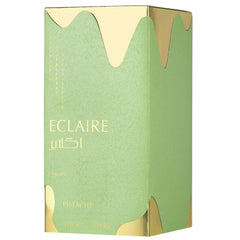 Lattafa Eclaire Pistache on vanity with scarf illustrating cozy wearable gourmand